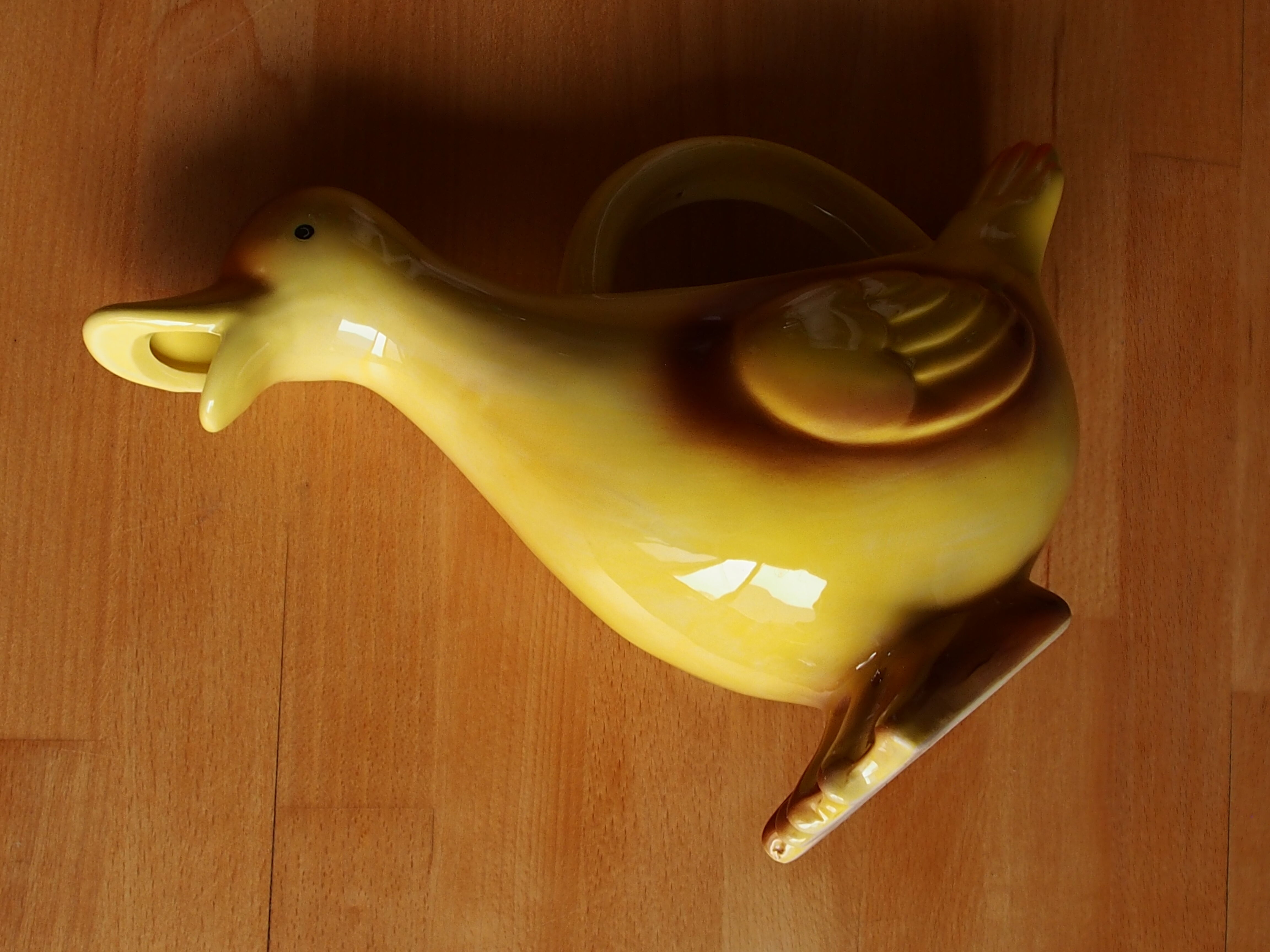 Ceramic watering can in white earthenware, yellow enamel and bird shape