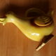 Ceramic watering can in white earthenware, yellow enamel and bird shape