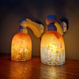 Pair of Art Deco wall sconces in multicoloured porcelain and frosted glass.