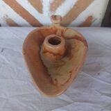 Vintage candle holder in the shape of a stylized Aladdin lamp