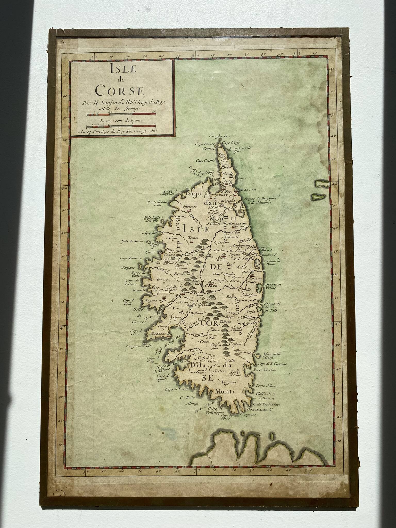 Old map of the Isle of Corsica framed under glass