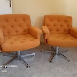 2 1970s swivel armchairs orange fabric