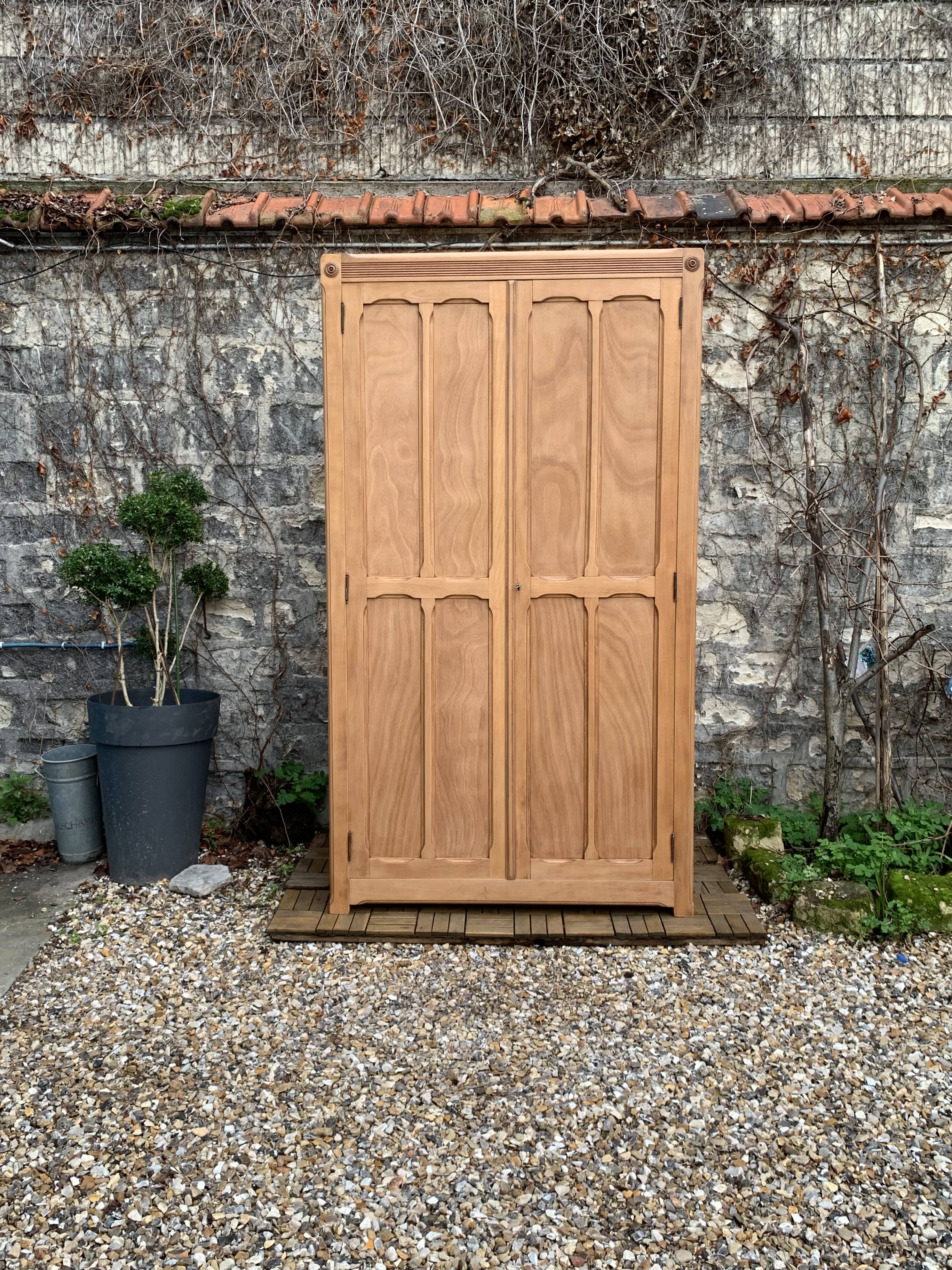 Parisian paneled cabinet in raw wood, 1940