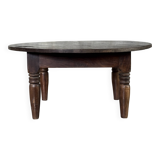 Coffee table, round antique Indonesian teak table with straight legs.