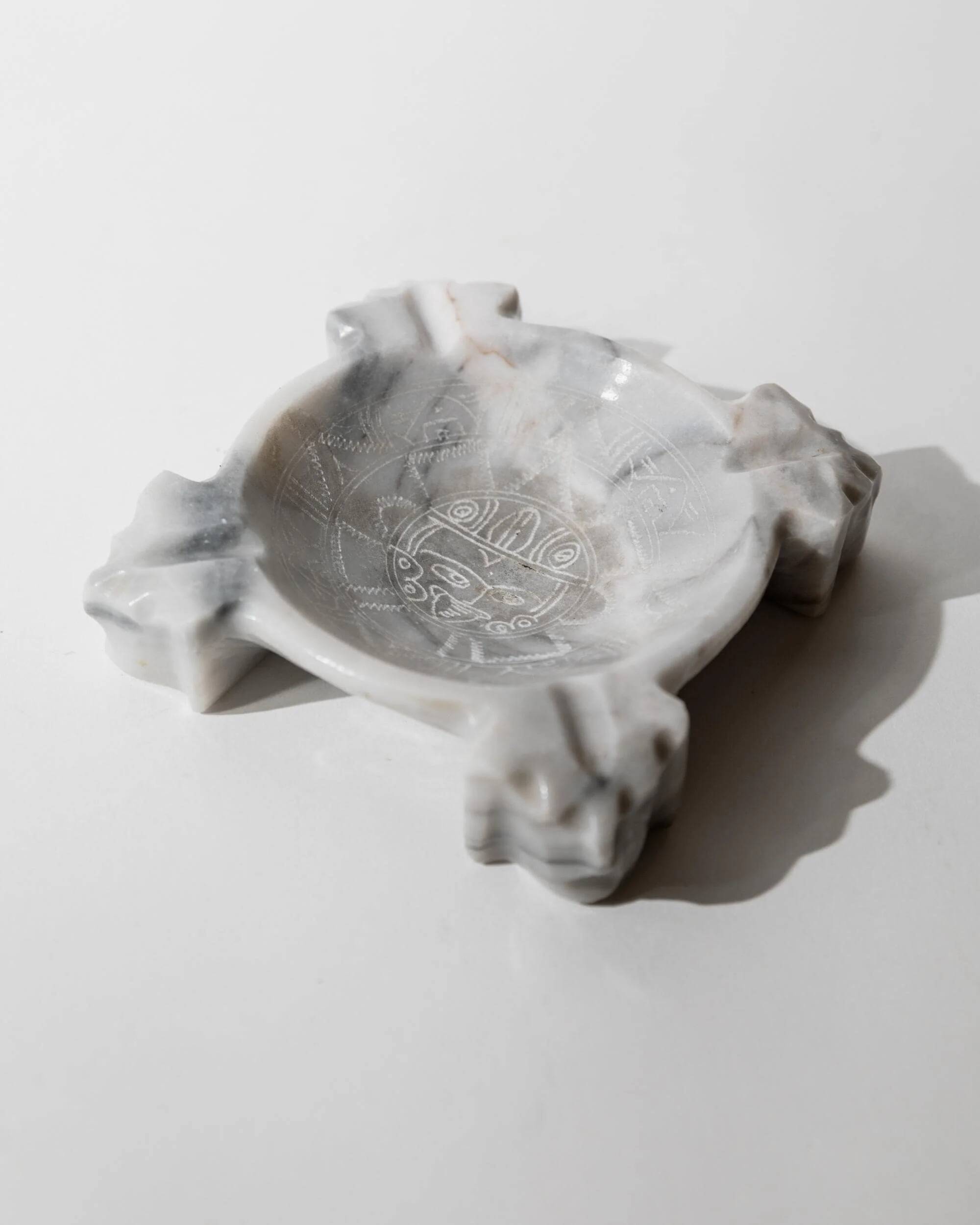 Vintage Mexican marble ashtray from the 1970s, engraved Aztec pattern.