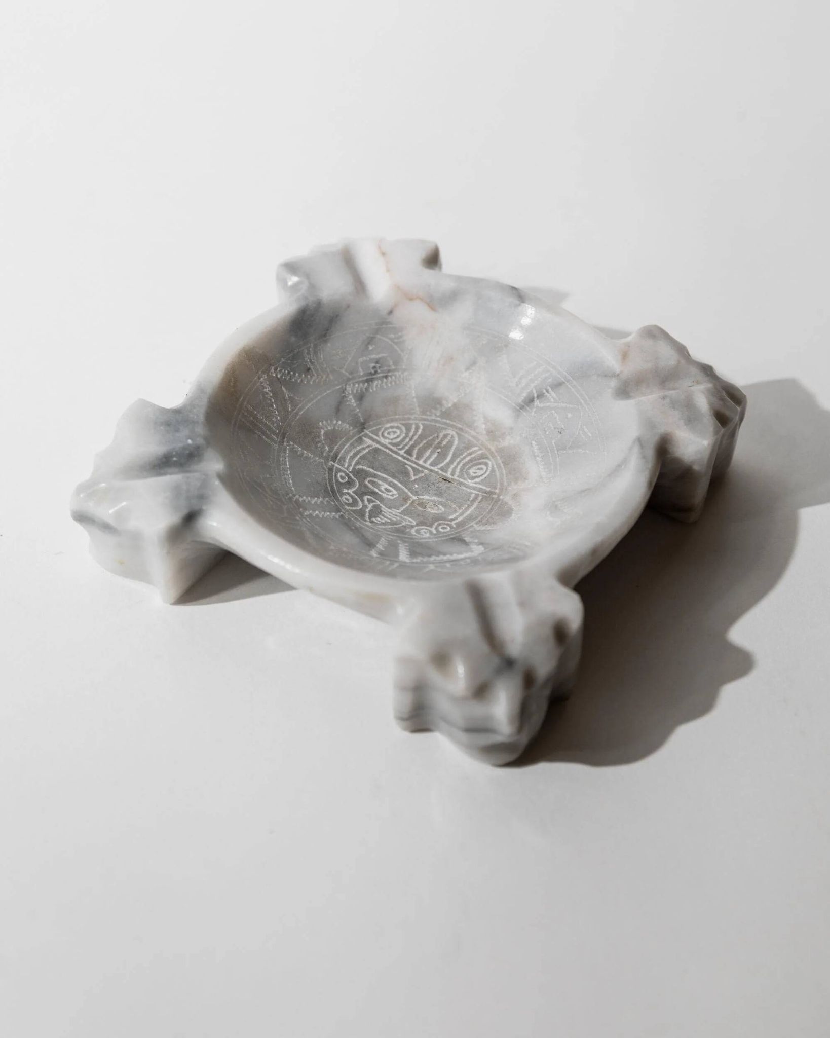 Vintage Mexican marble ashtray from the 1970s, engraved Aztec pattern.