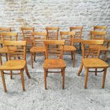12 varnished bistro chairs