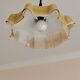 Electrified suspension with a frosted opaque glass disc shade.