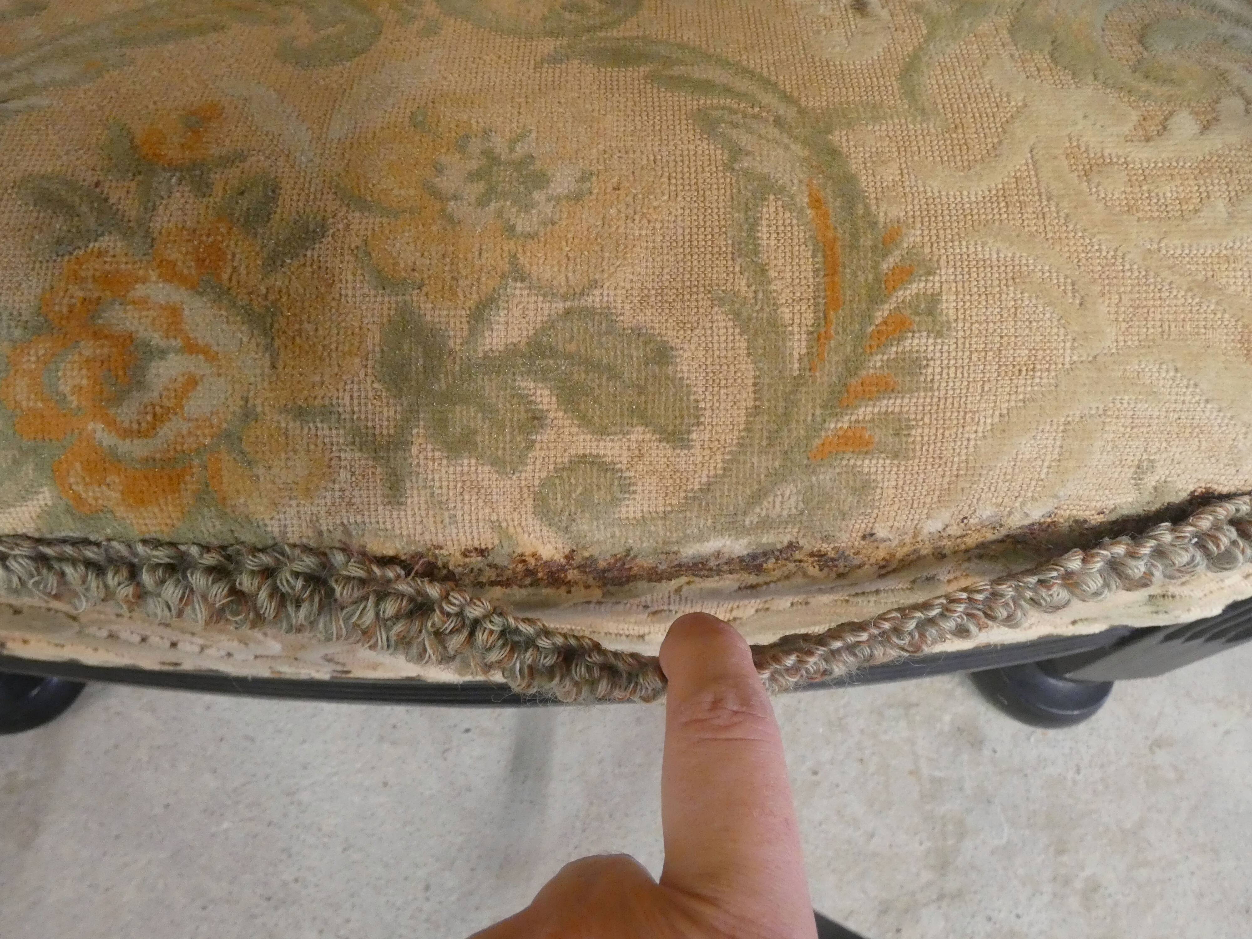 Old armchair upholstered in velvet, carved and caned wood