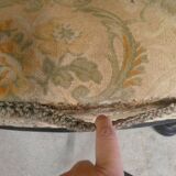 Old armchair upholstered in velvet, carved and caned wood