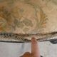 Old armchair upholstered in velvet, carved and caned wood