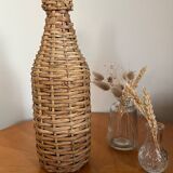 Bouteille en verre et rotin vintage