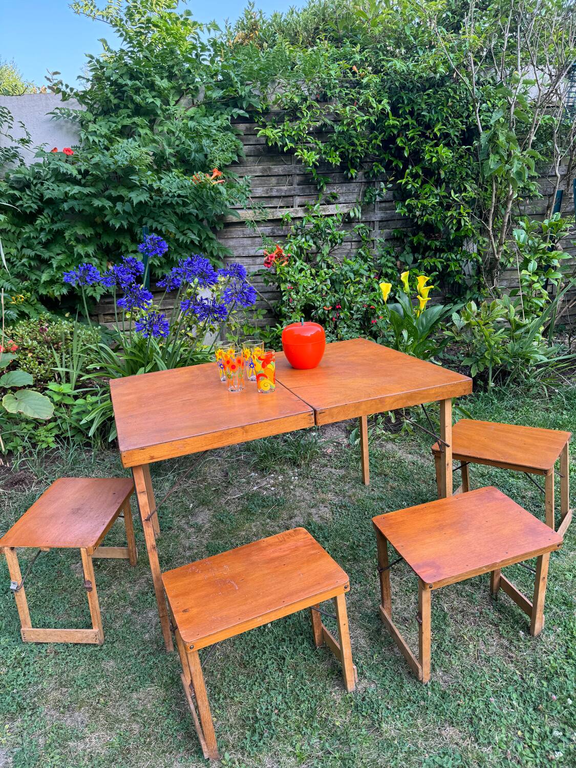 Old suitcase, table and stools, vintage wooden picnic