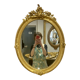 Miroir oval en bois doré 70x49cm