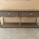 Wall-mounted console in wood, grey lacquer with a highlighted edge.