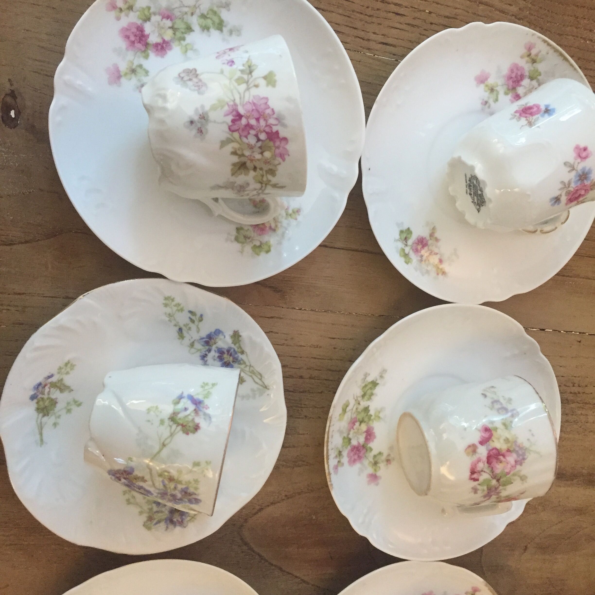 6 antique cups and mismatched saucers