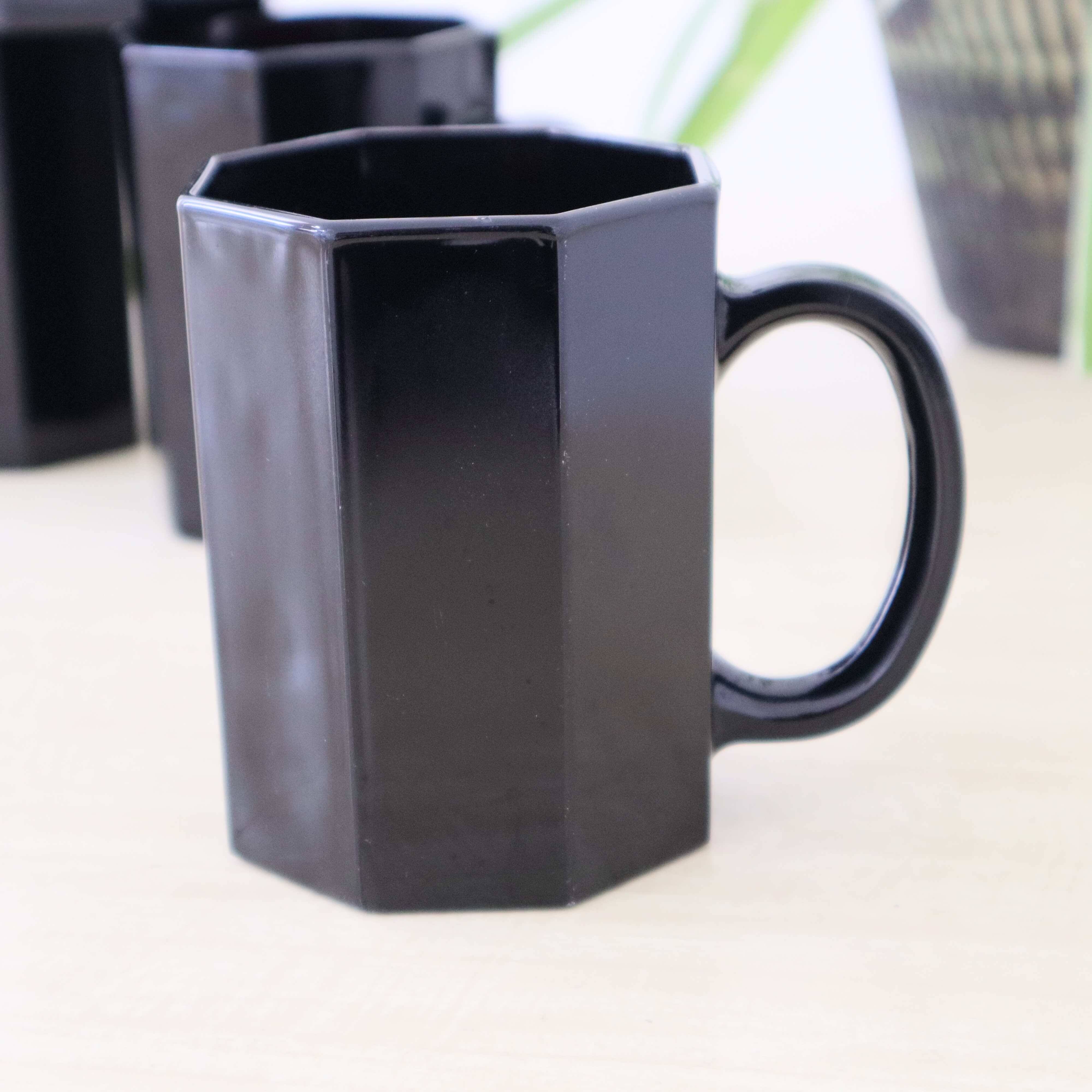 4 black "Octime" Arcoroc mugs