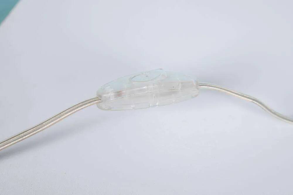 Minimalist glass table lamp from the 80s with a pleated shade.