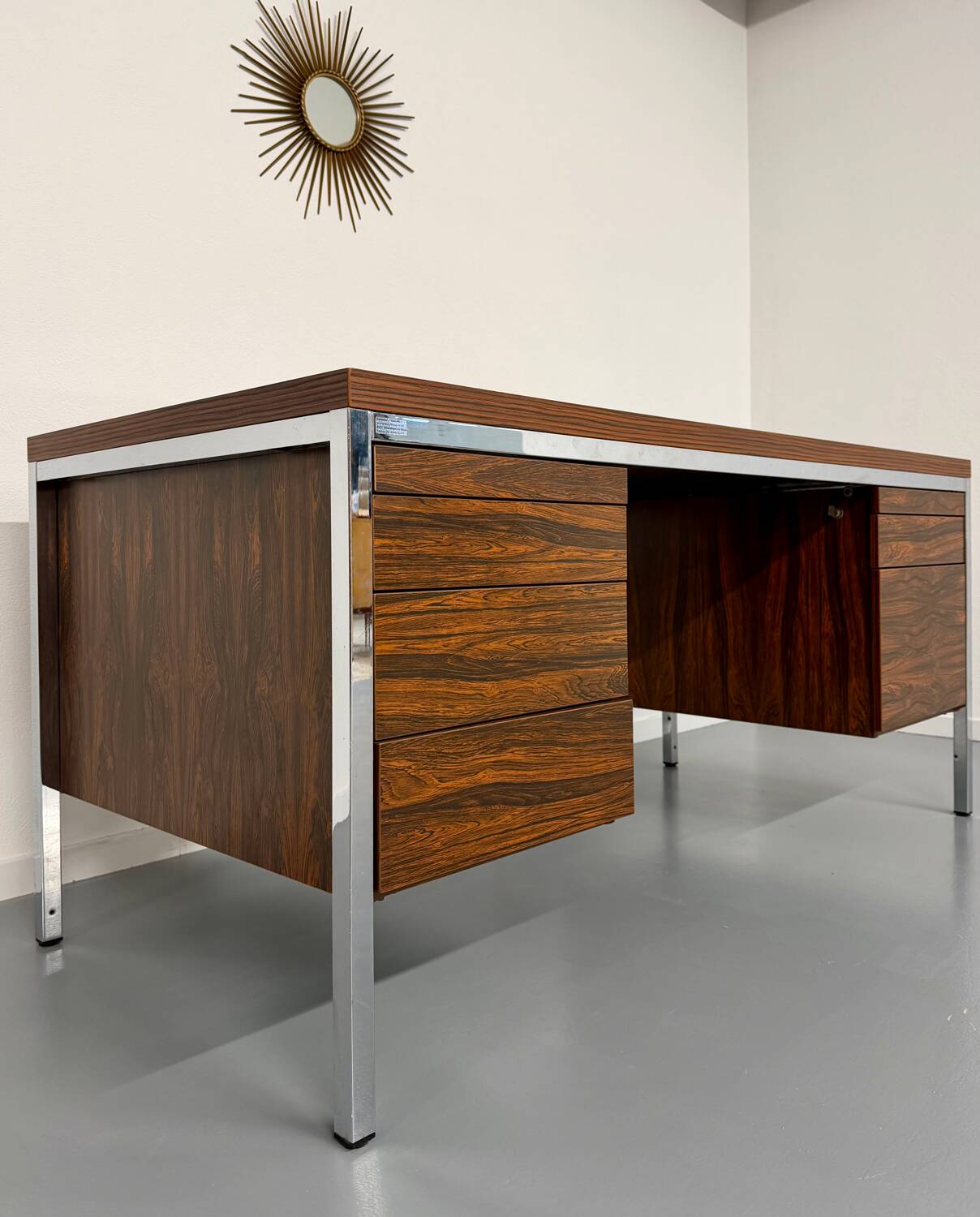 Vintage desk with rosewood veneer and chrome metal design from the 1970s.