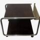 1970s/80s coffee table on casters with metal tubing, light-colored door