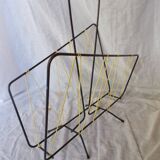 Black metal magazine rack with yellow scoubidou thread