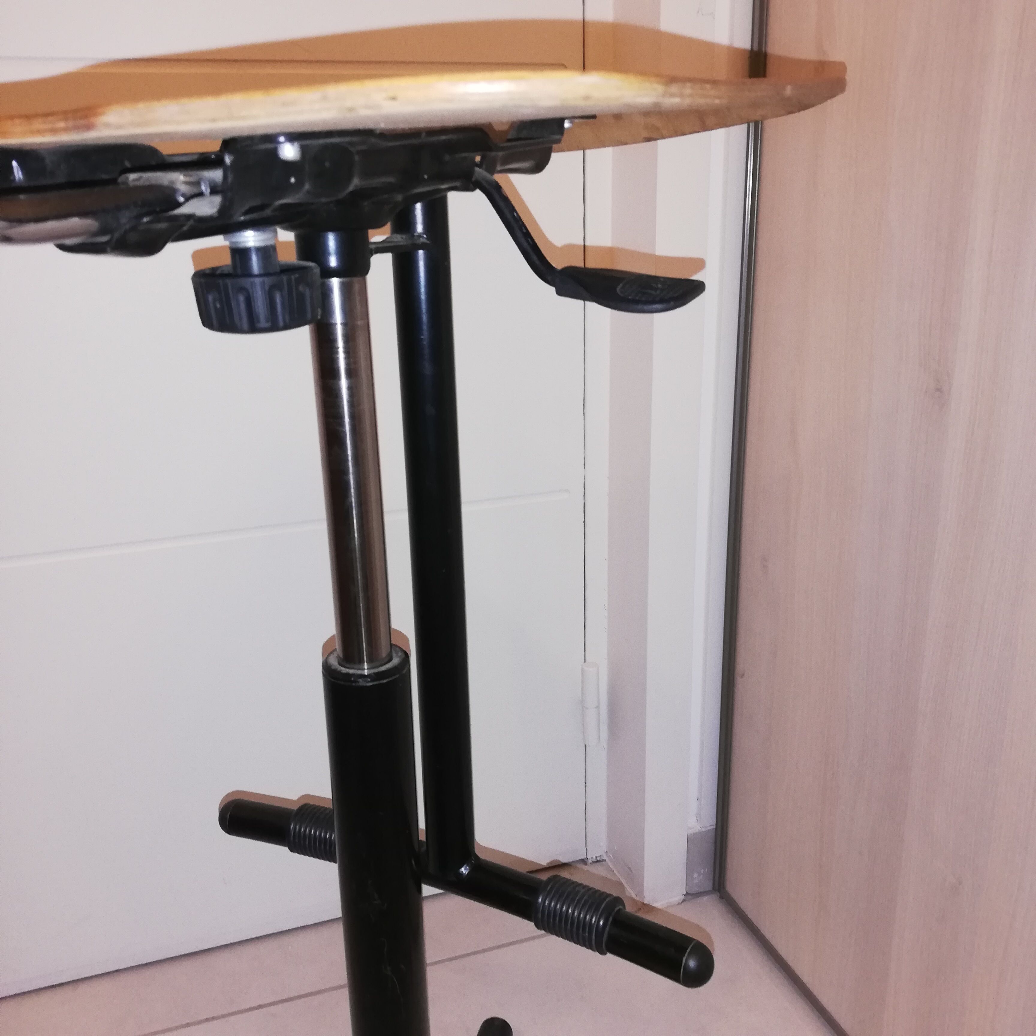 Industrial chair with height adjustment and foot rests