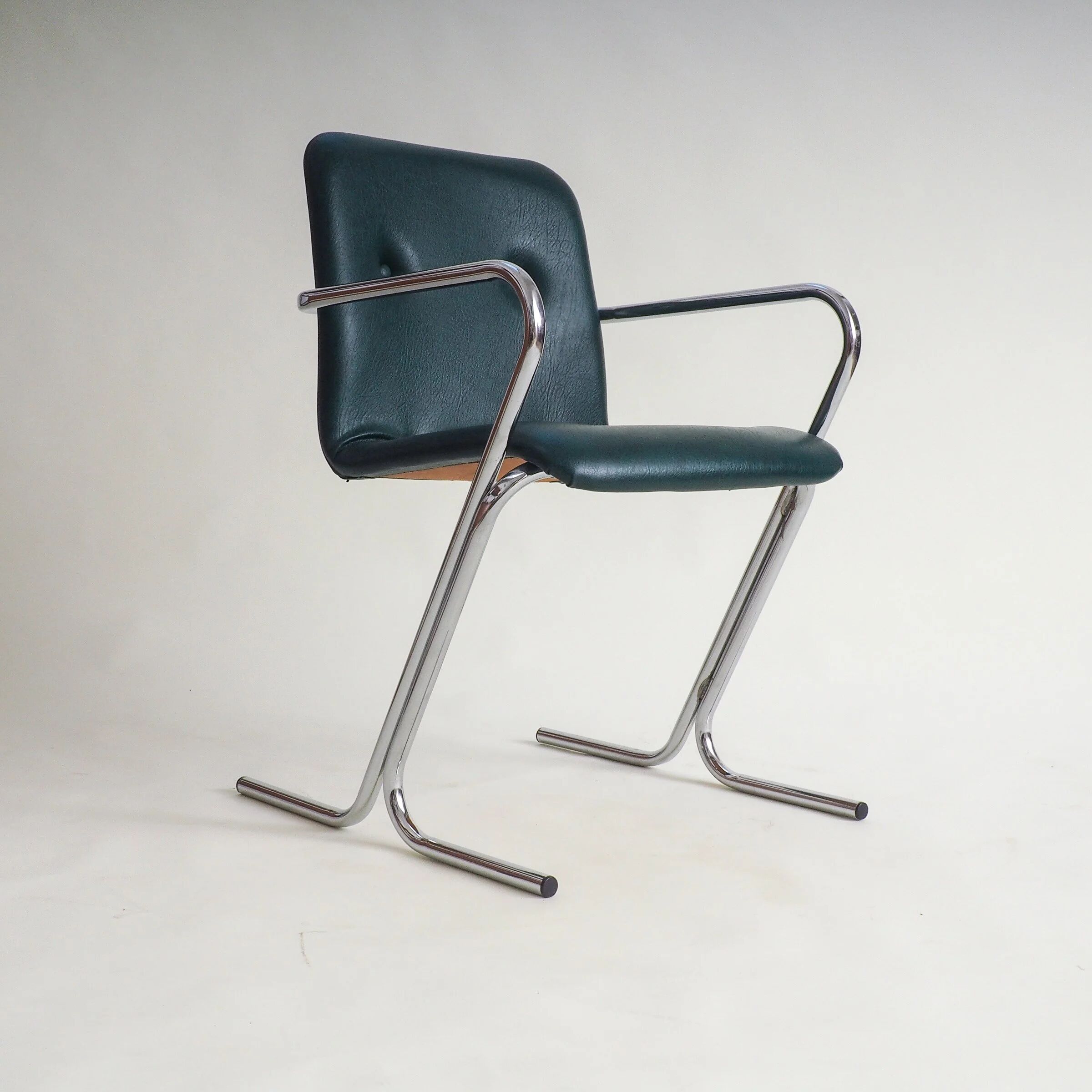 70s tubular arm chair by Tavo
