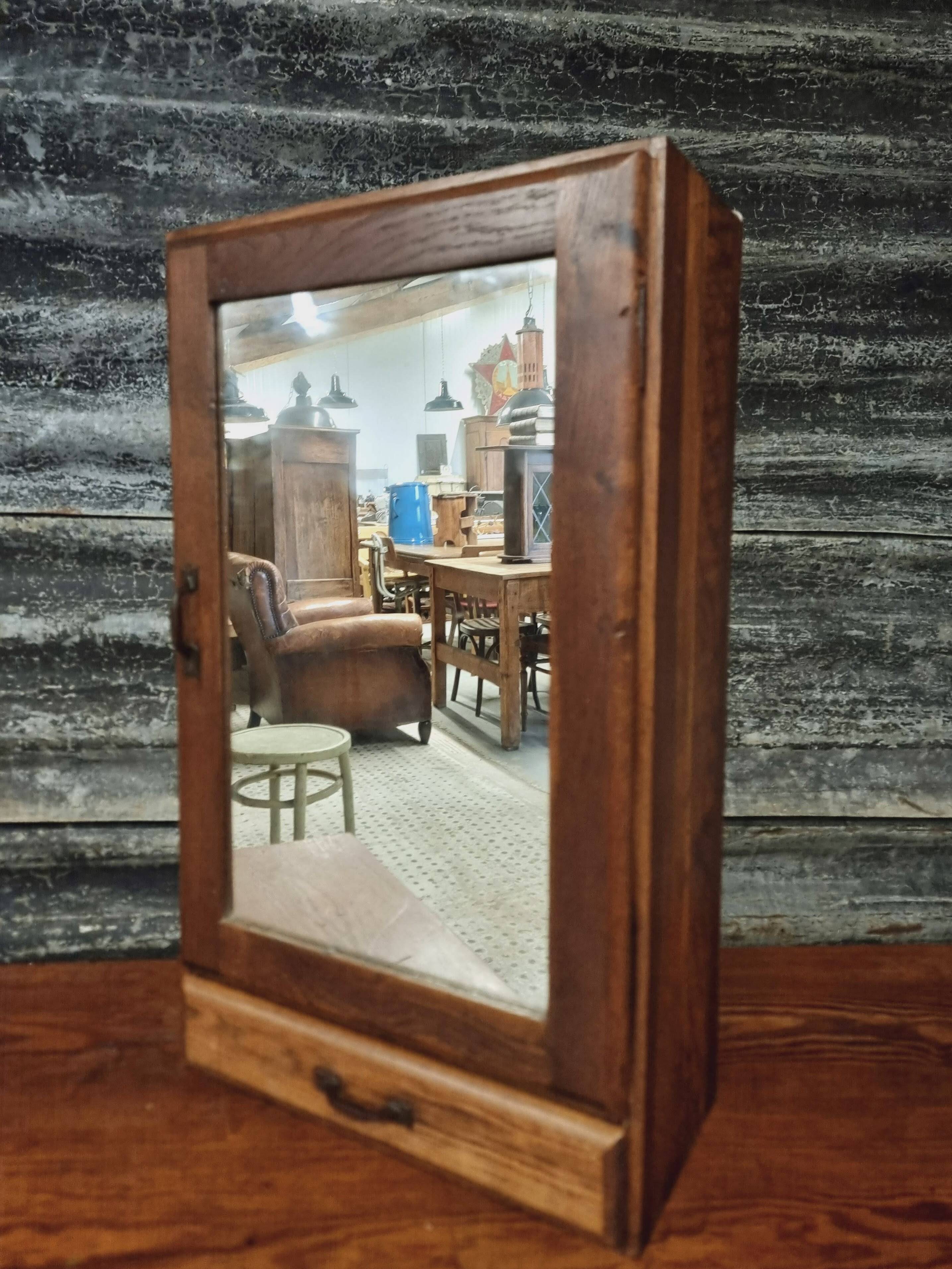 Old hanging cupboard medicine cabinet with mirror and drawer