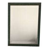 Beveled mirror and varnished wooden frame