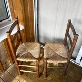 Set of wooden and straw chairs