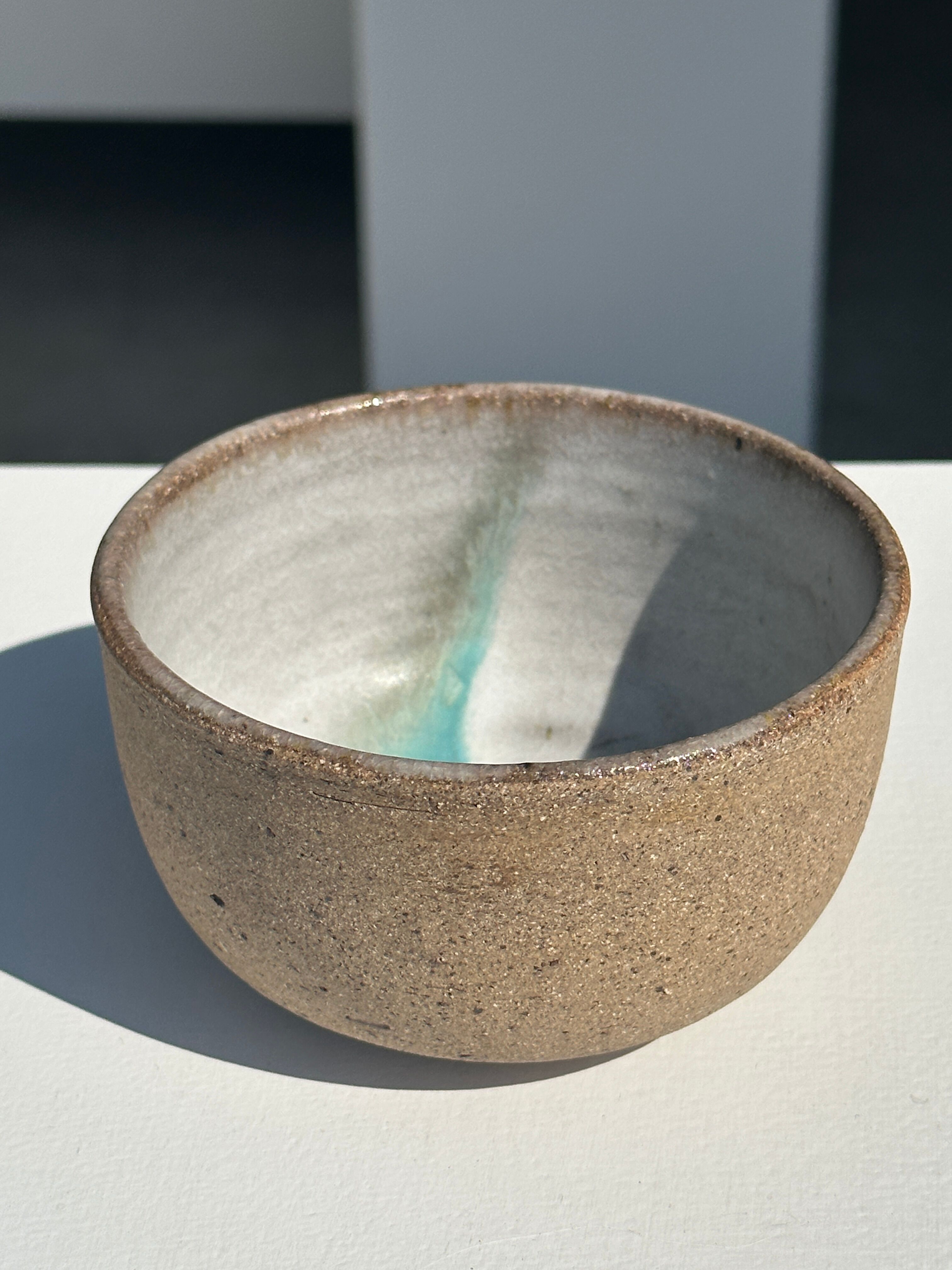 Small brown bowl inside blue and white