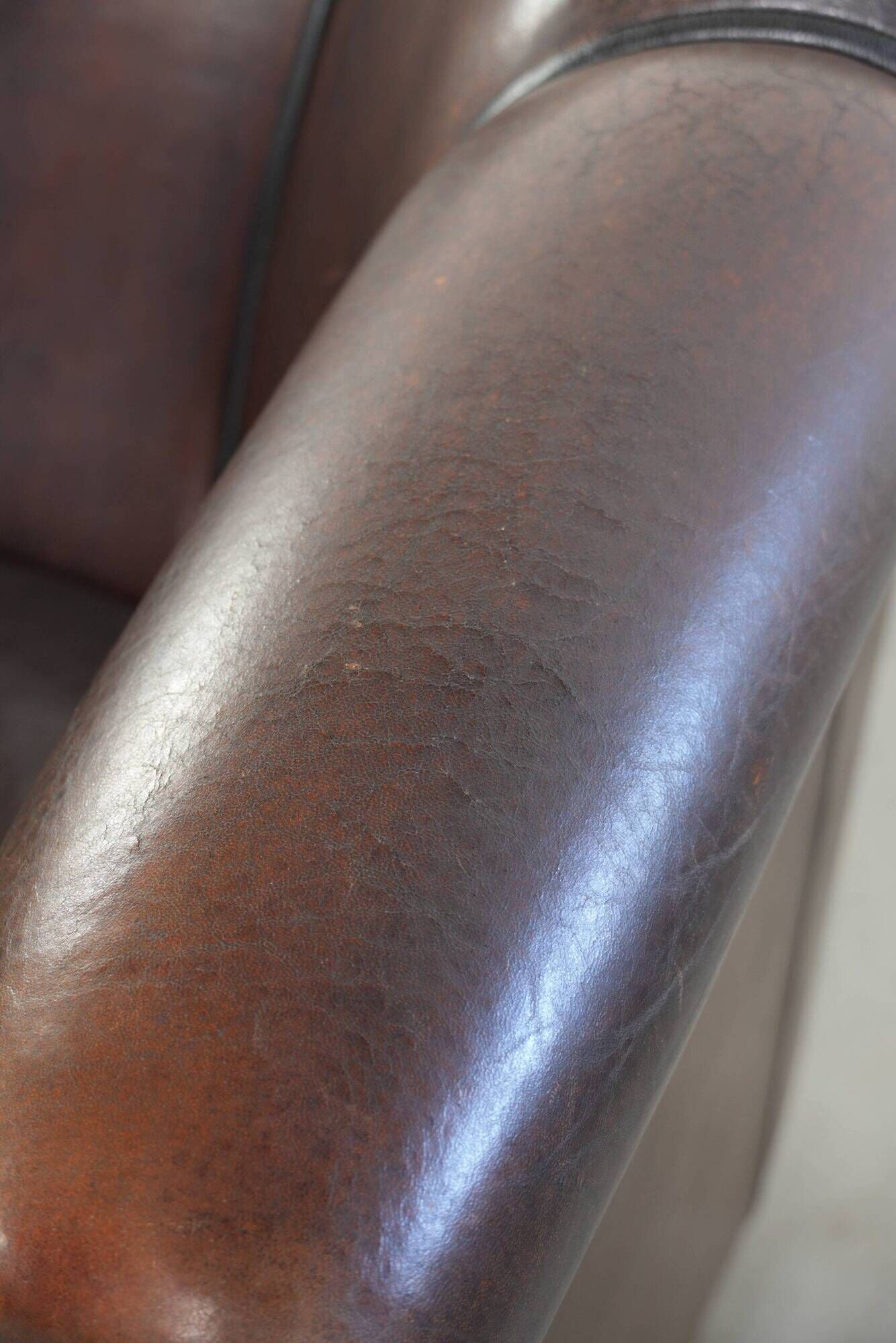 Set of a sheepskin sofa together with its matching club armchair