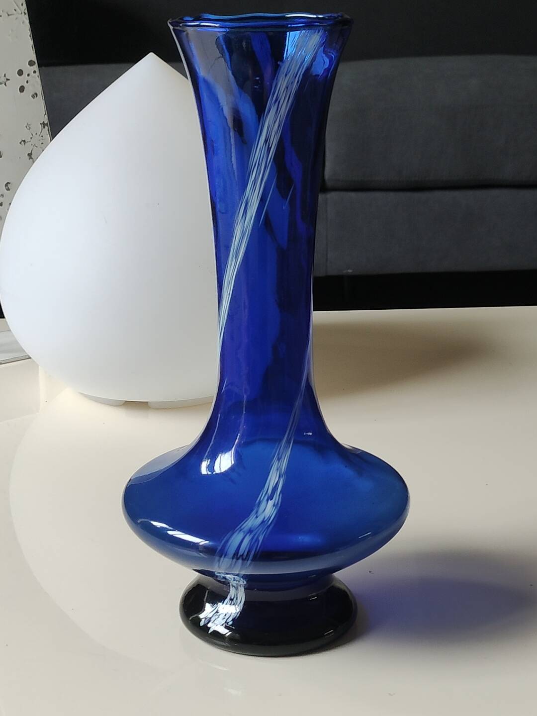 Long flared neck ball vase. Smoked scrolls in cobalt blue art glass, 30cm