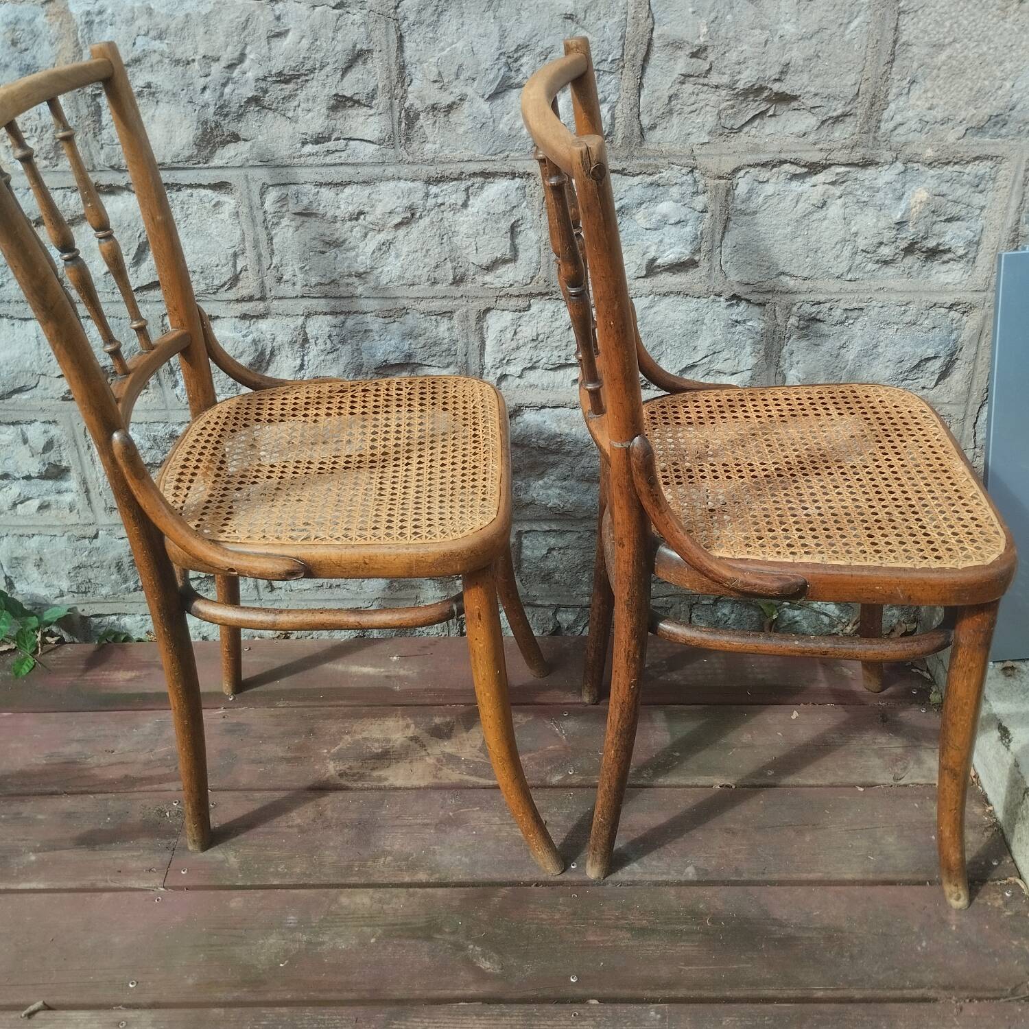 Set of 2 antique bistro chairs. Curved and turned wood.