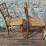 Set of 2 antique bistro chairs. Curved and turned wood.