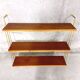 Vintage wall shelf in teak and golden brass String Tomado style