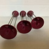 Trio of vintage burgundy candlesticks