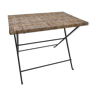 Folding table in black forged iron and wicker braided table top