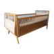 Wooden baby bed and vintage rattan