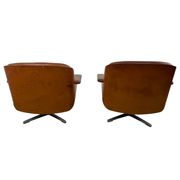Pair of vintage cognac leather swivel lounge chairs by Eugen Schmidt