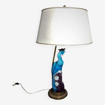 Large table lamp with earthenware peacock and beige silk lampshade