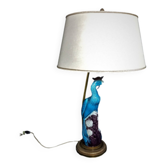 Large table lamp with earthenware peacock and beige silk lampshade