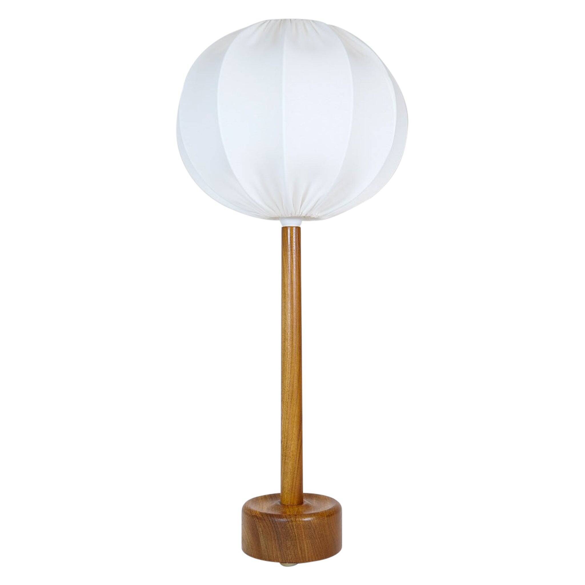 Mid-century solid teak table lamp from the 1960s Sweden.
