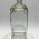 Glass bottle decorated with gold motifs