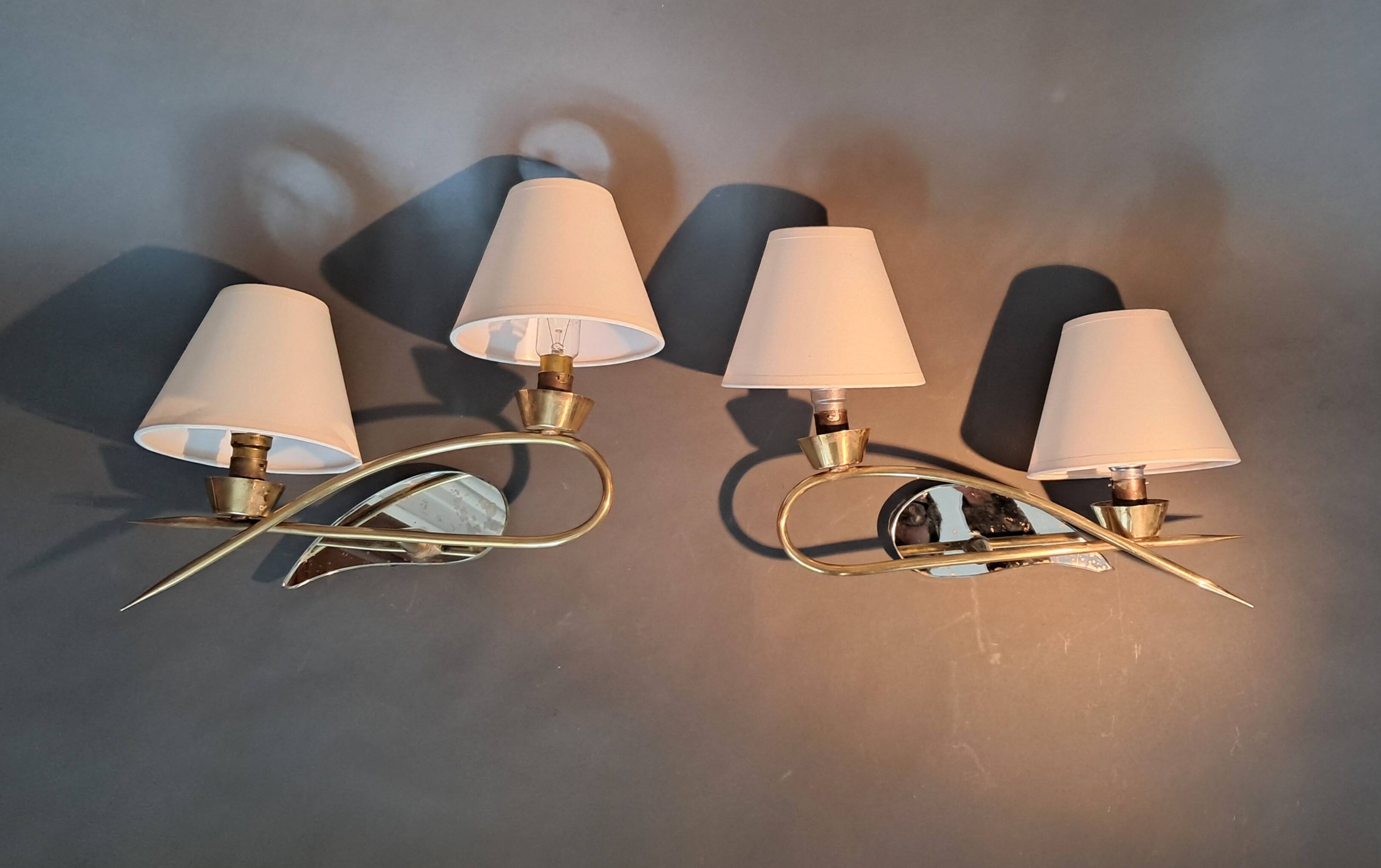 Pair of gilded brass and mirror wall lights, Circa 1960.