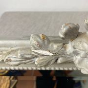 Large antique beveled mirror in carved wood painted with floral decoration and