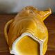 Pig slip pitcher