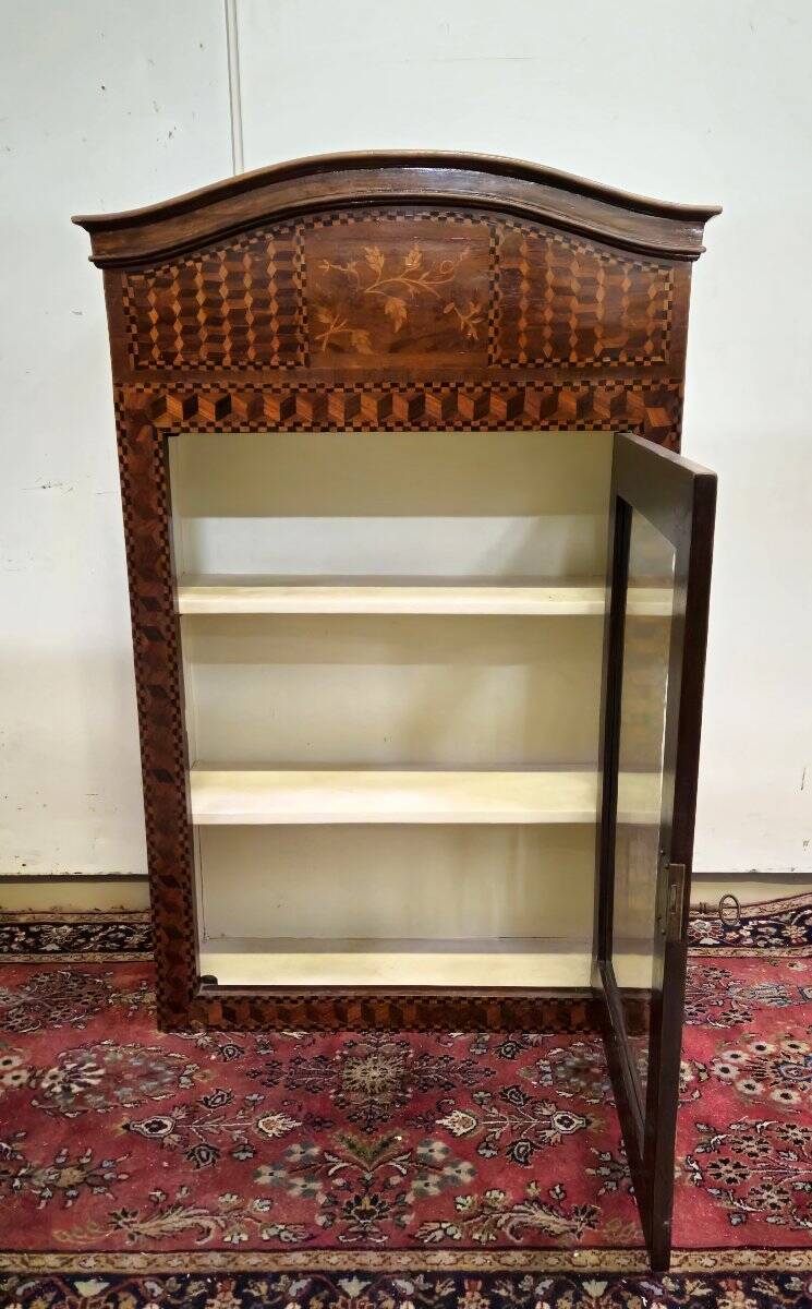 Antique Louis XV display cabinet with geometric marquetry decoration.