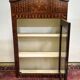 Antique Louis XV display cabinet with geometric marquetry decoration.