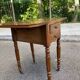 Victorian Pembroke table from the 19th century in walnut burr with drop-leaves.